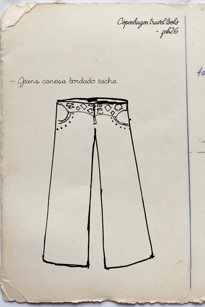 JEANS WITH EMBROIDERED YOKE AND STUDS
