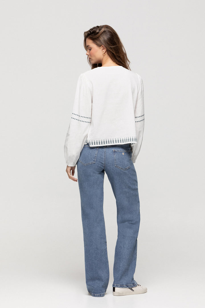 JEANS WITH EMBROIDERED YOKE AND STUDS