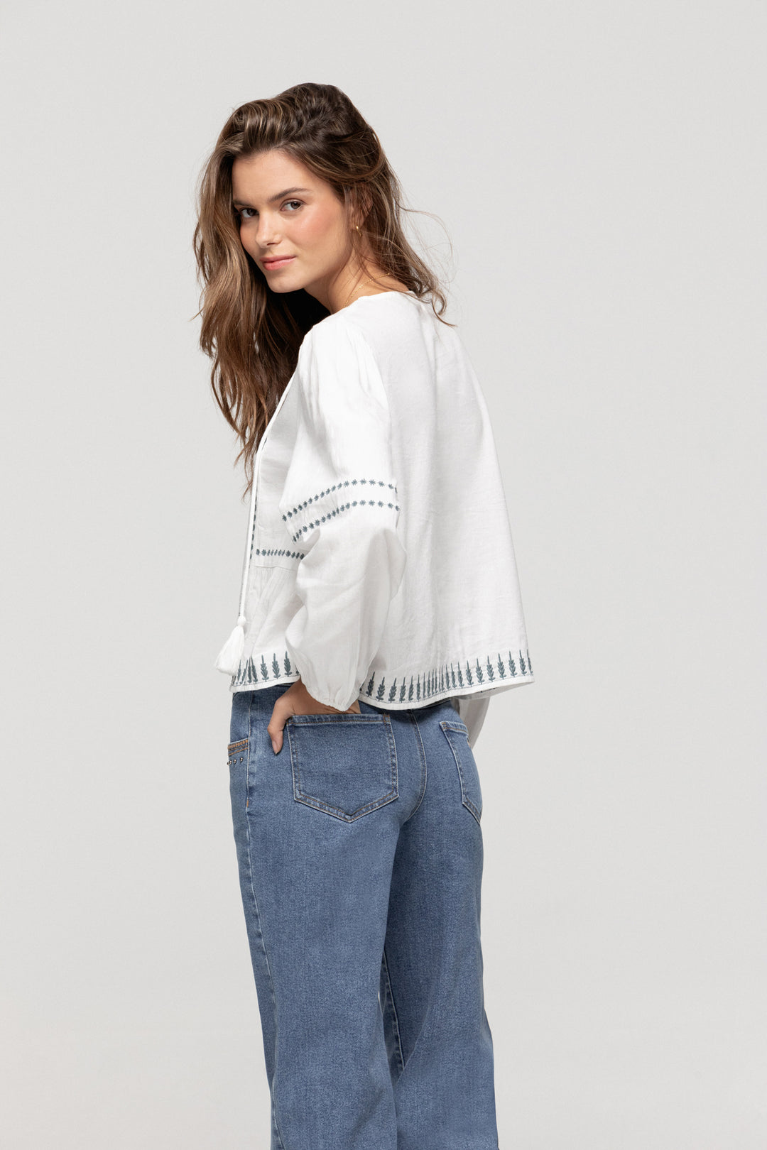 JEANS WITH EMBROIDERED YOKE AND STUDS