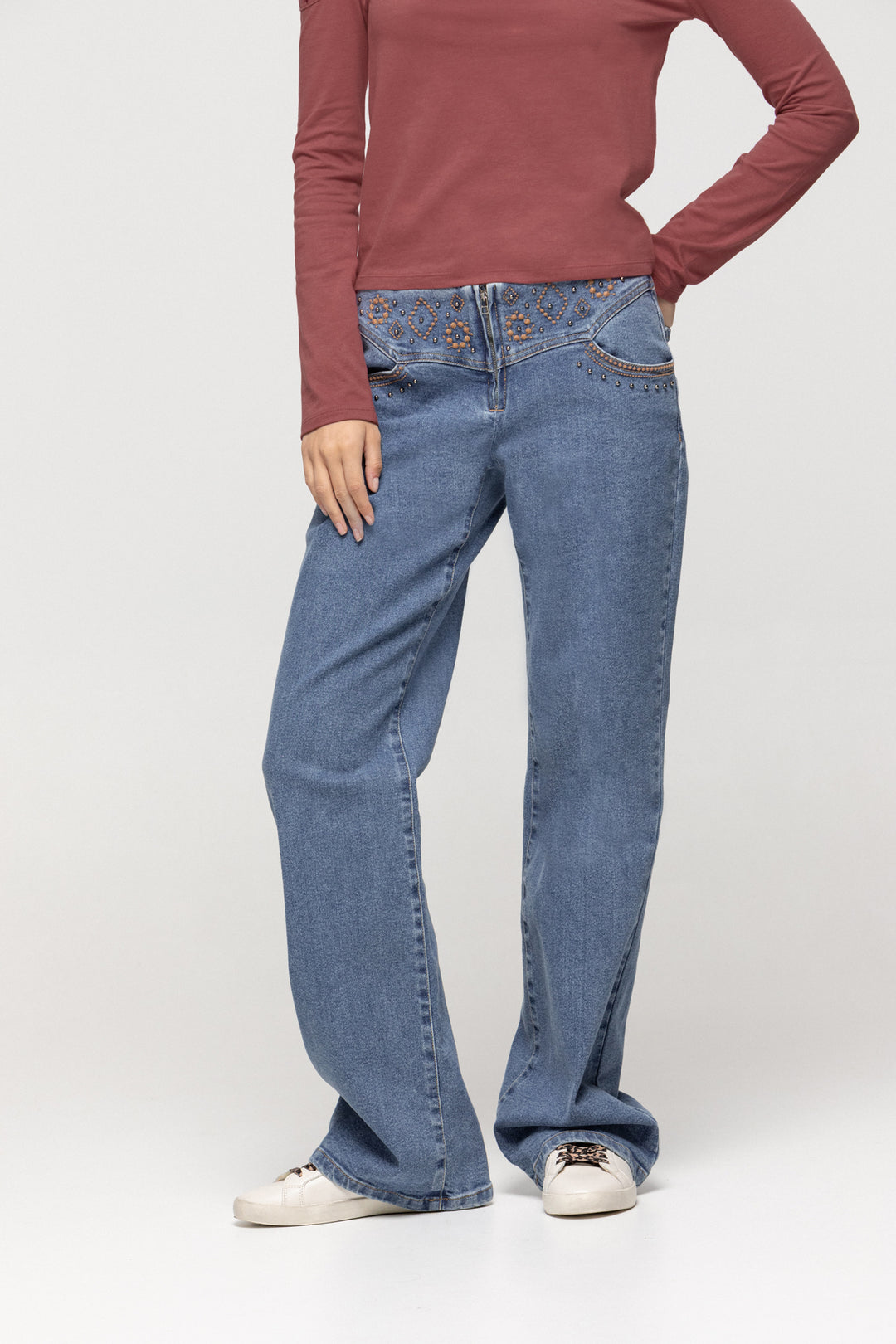 JEANS WITH EMBROIDERED YOKE AND STUDS