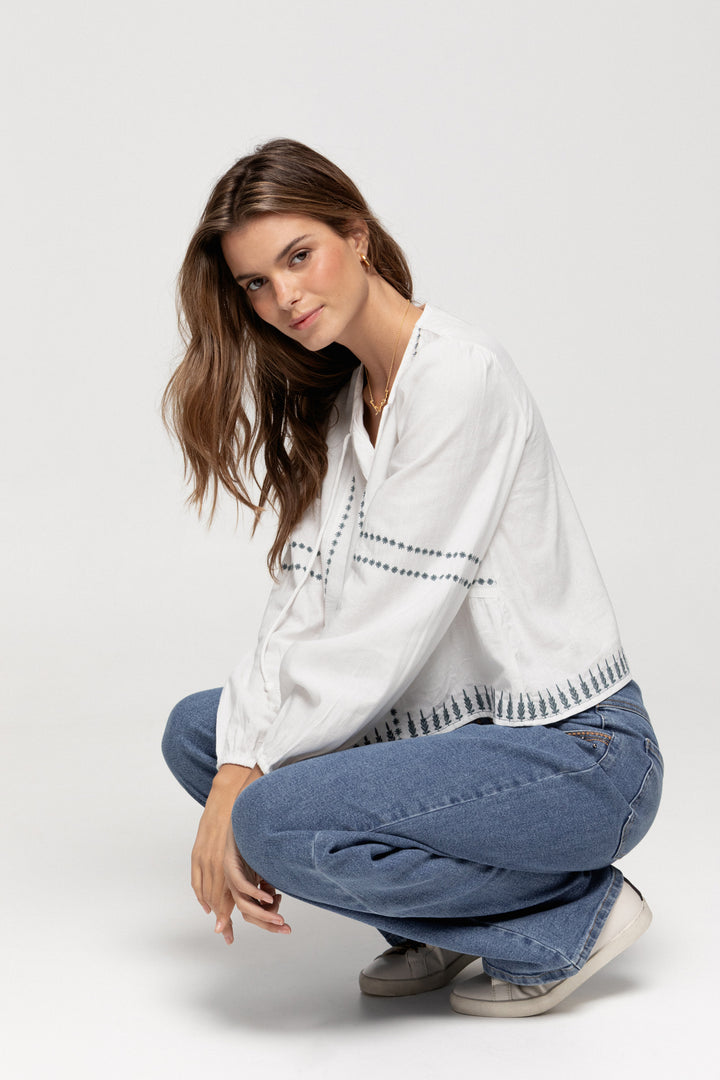 JEANS WITH EMBROIDERED YOKE AND STUDS