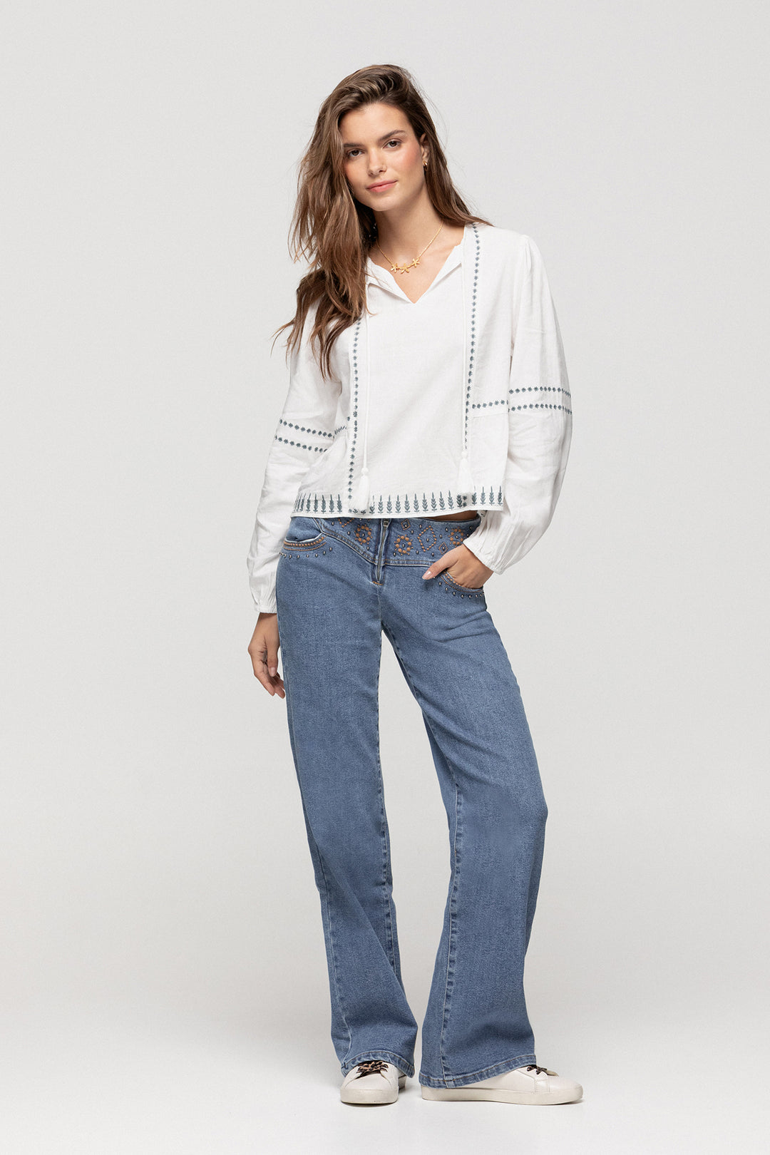 JEANS WITH EMBROIDERED YOKE AND STUDS