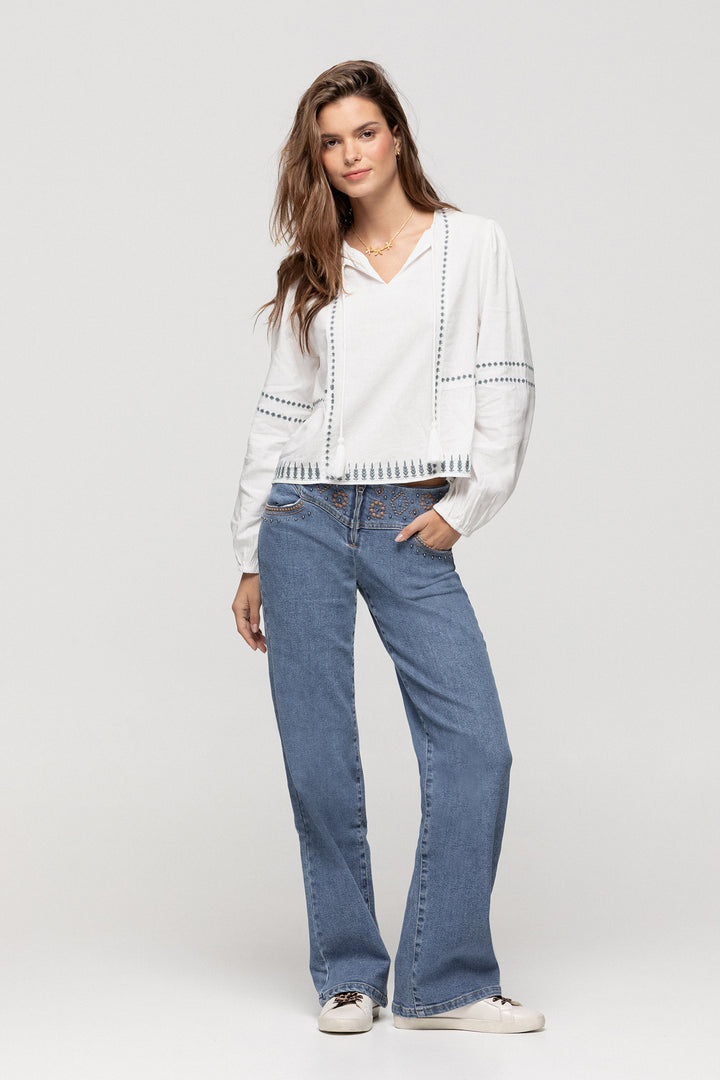 JEANS WITH EMBROIDERED YOKE AND STUDS