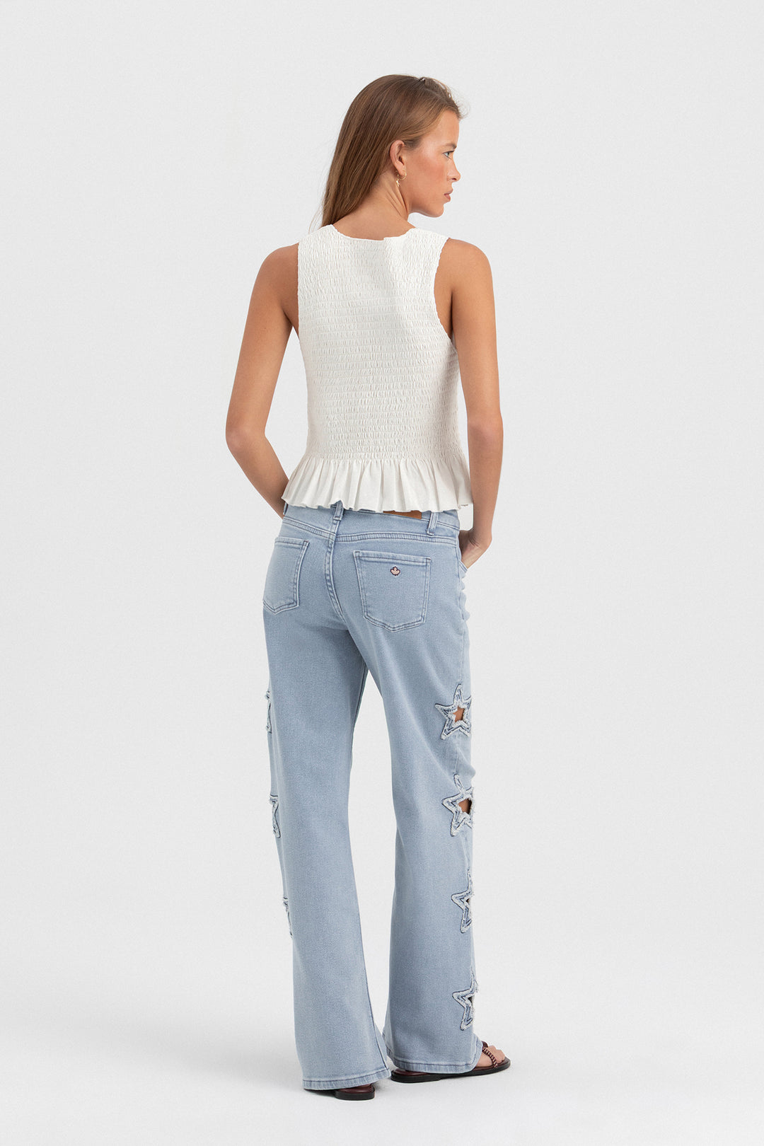 CALÇA DE GANGUE CORTADA A LASER COM ESTRELAS