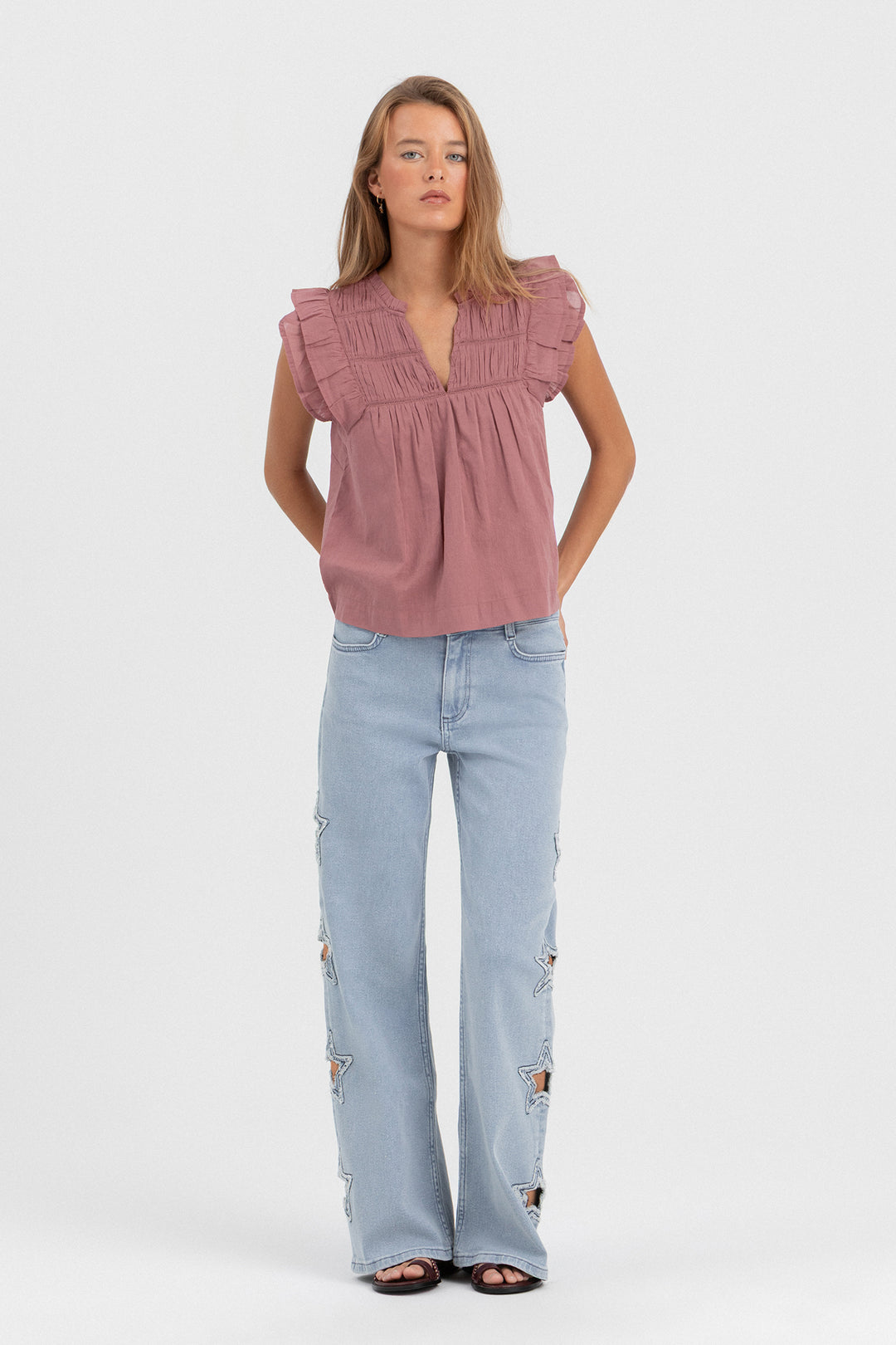 CALÇA DE GANGUE CORTADA A LASER COM ESTRELAS