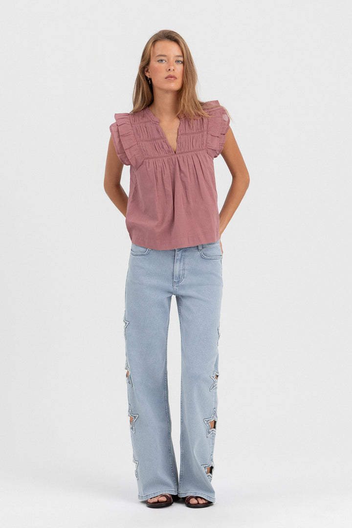 CALÇA DE GANGUE CORTADA A LASER COM ESTRELAS