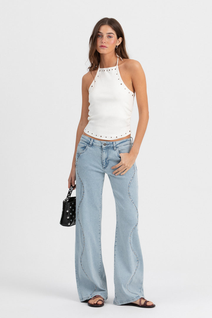 Calças de ganga com ondas e tachas