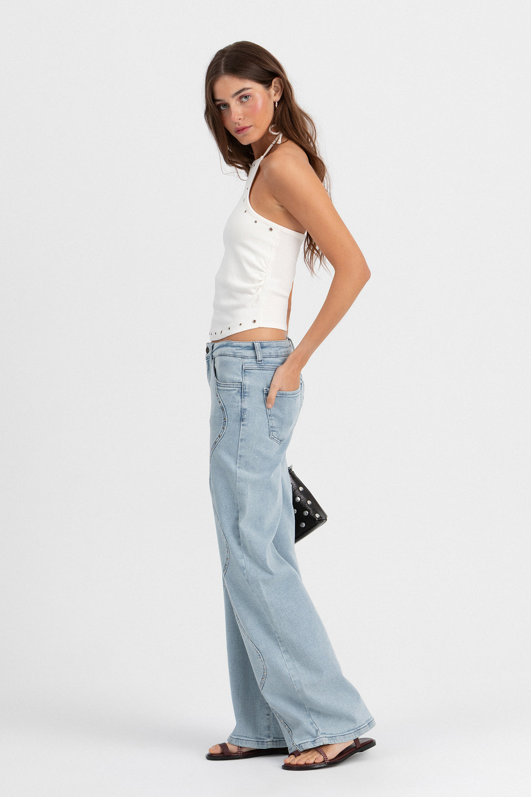 Calças de ganga com ondas e tachas