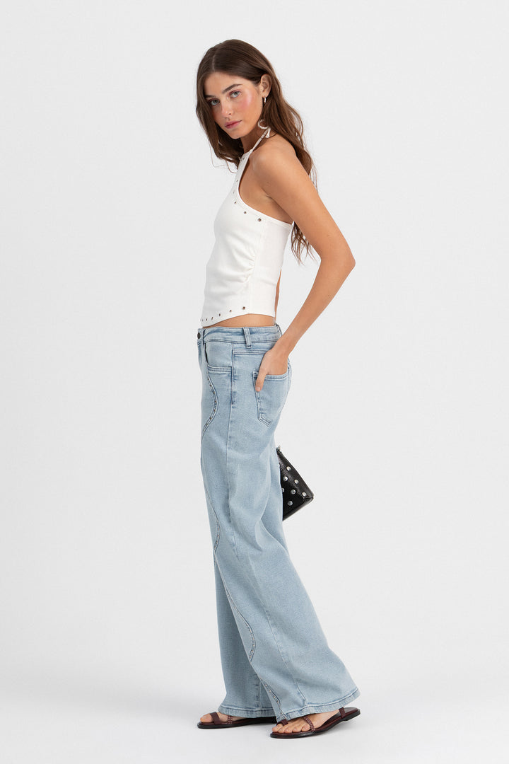 Calças de ganga com ondas e tachas