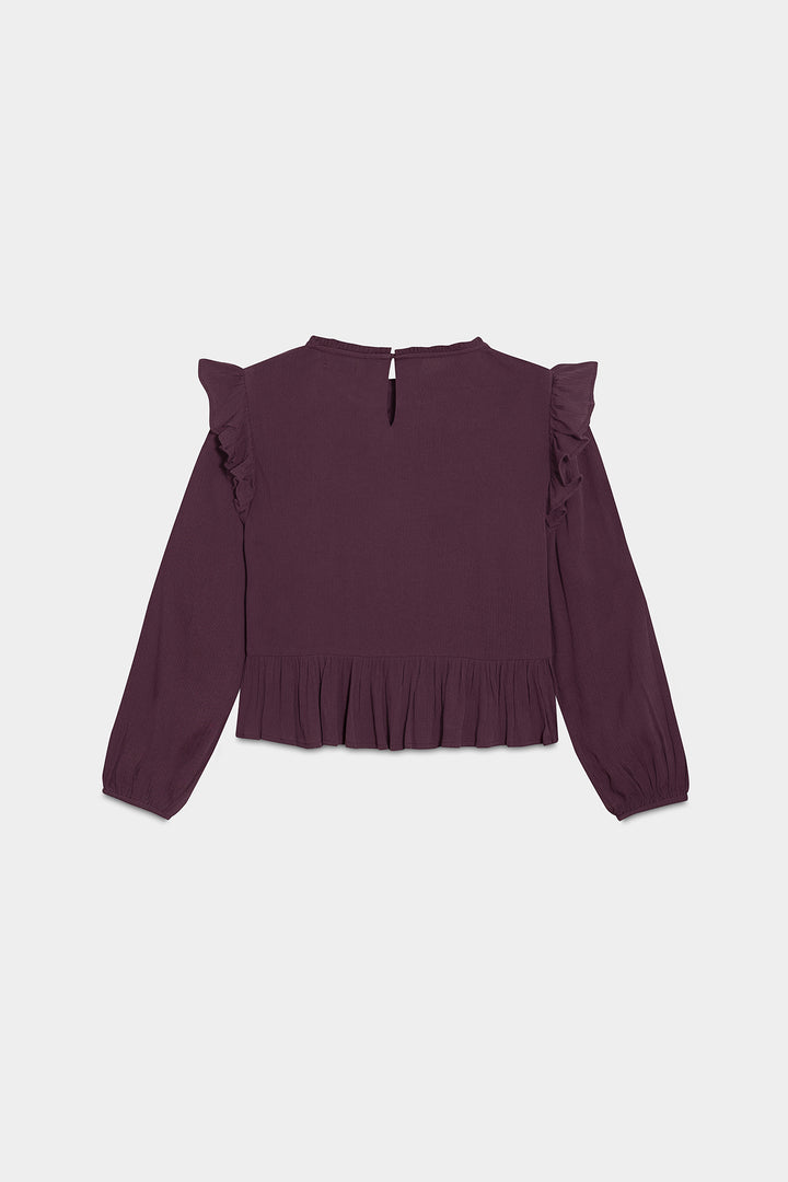 Detalhes da blusa com folhos